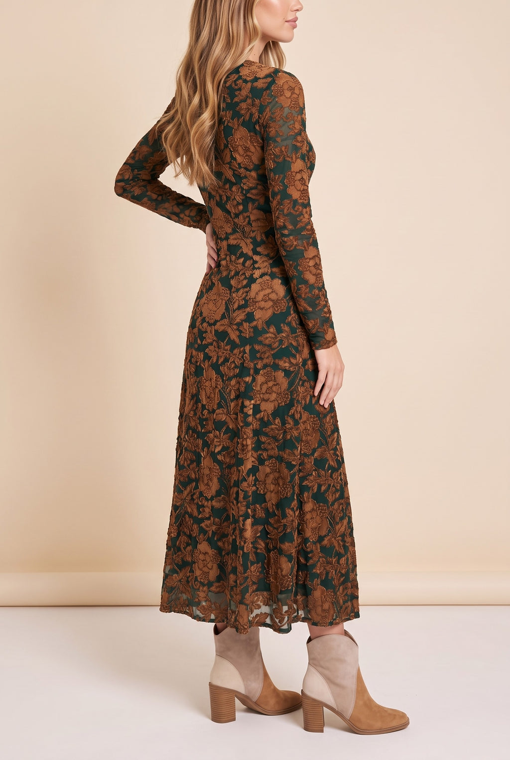 Side view of the green velvet burnout floral maxi dress showing the silhouette.