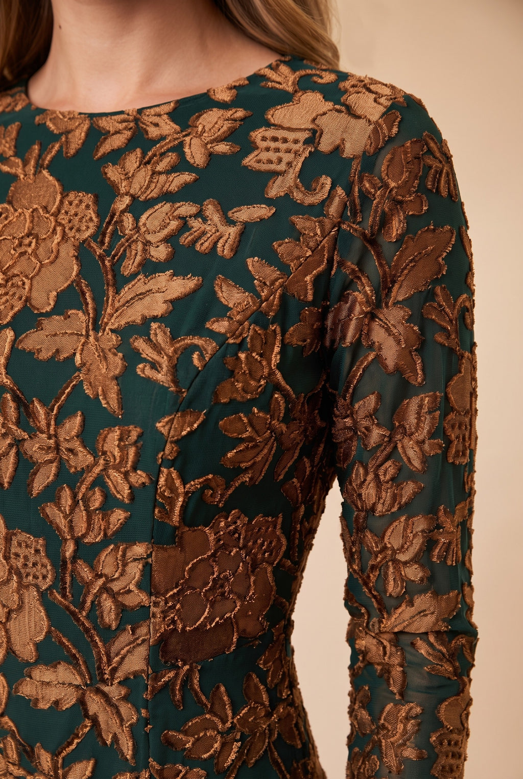 Close-up of the green velvet burnout floral maxi dress showing the fabric and finishing details.