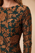 Close-up of the green velvet burnout floral maxi dress showing the fabric and finishing details.