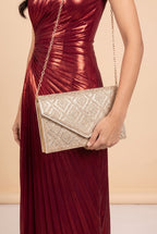 The Gemma rhinestone envelope clutch carried at the hip.