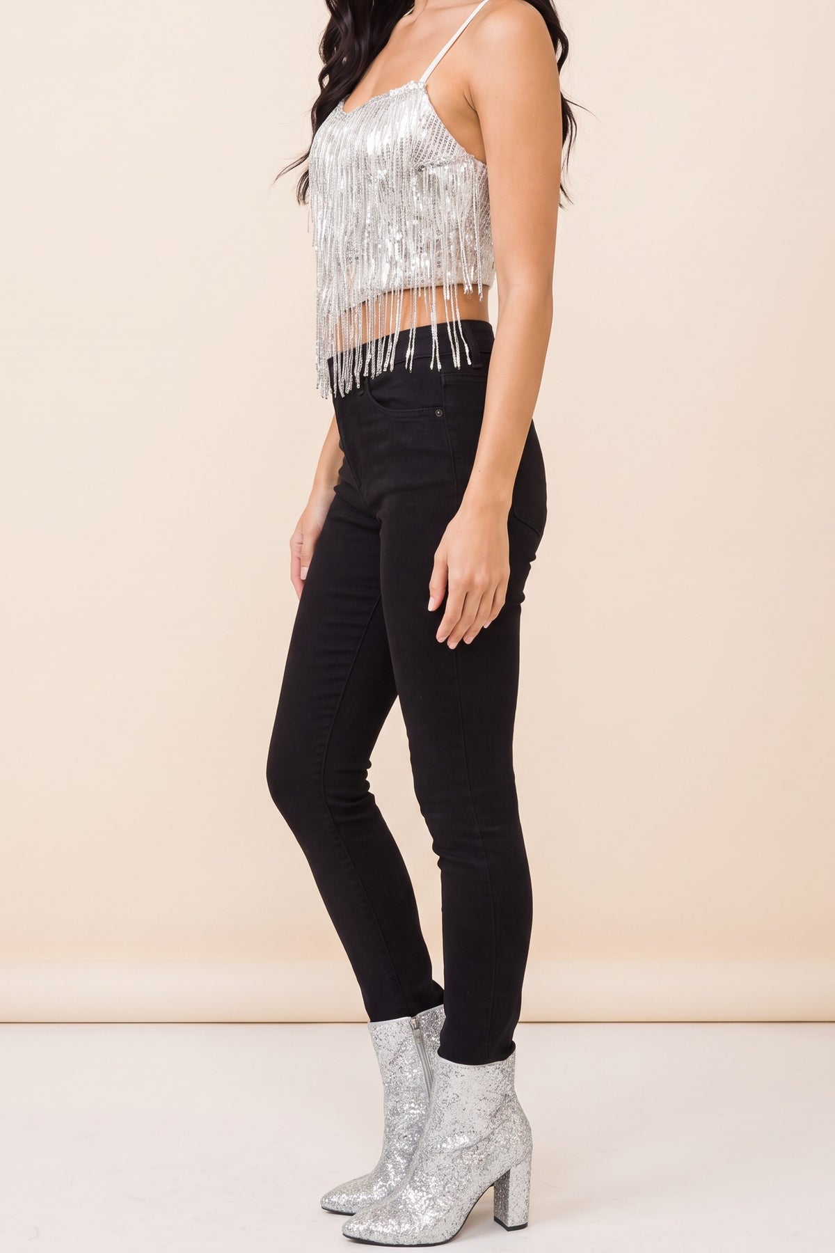 Side view of the Dancing in the Moonlight sequin fringe cami worn by our model.