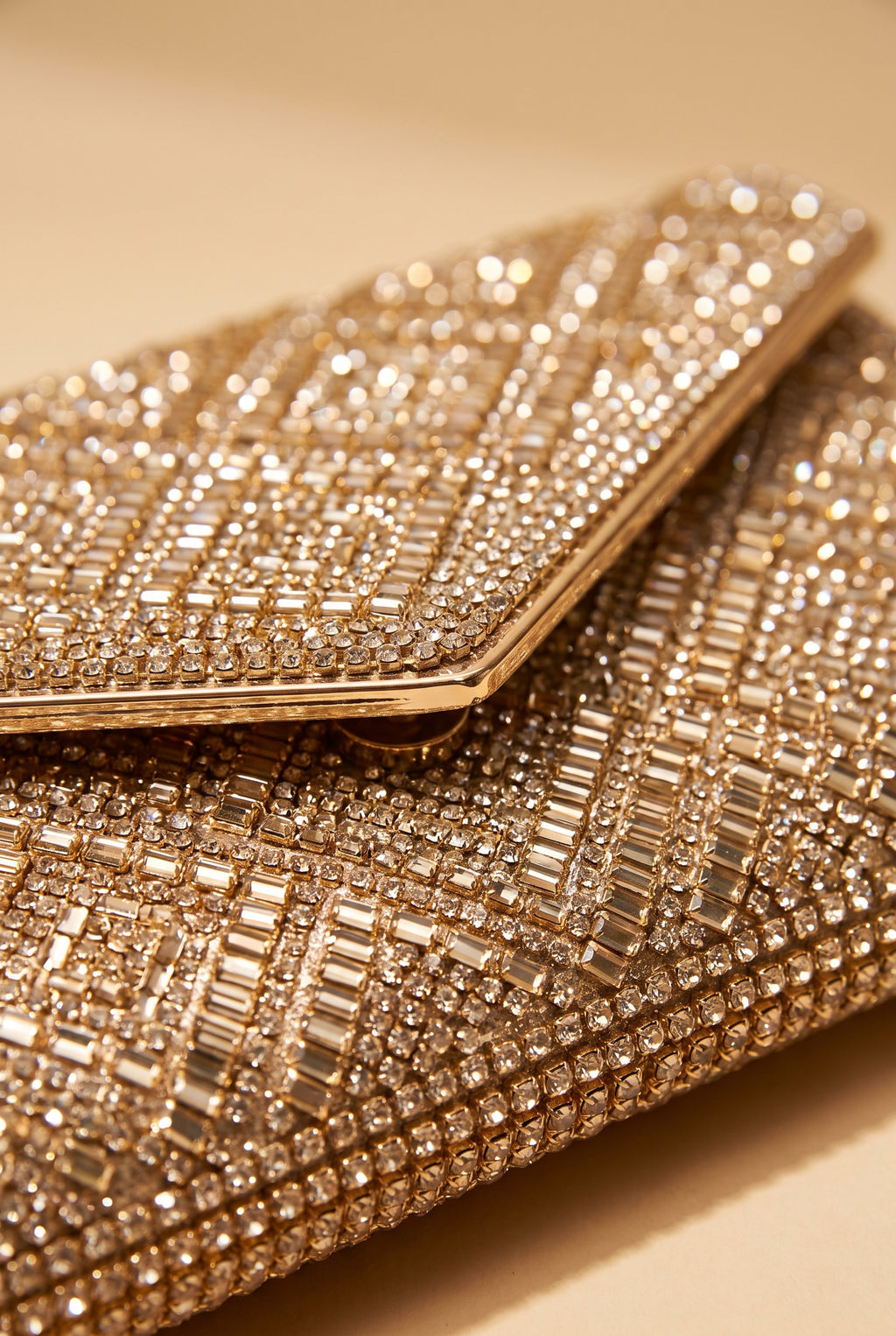 Close view of the Gemma rhinestone envelope clutch showing the material and details.