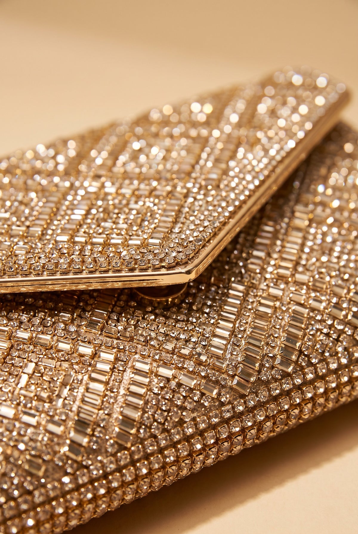 Close view of the Gemma rhinestone envelope clutch showing the material and details.
