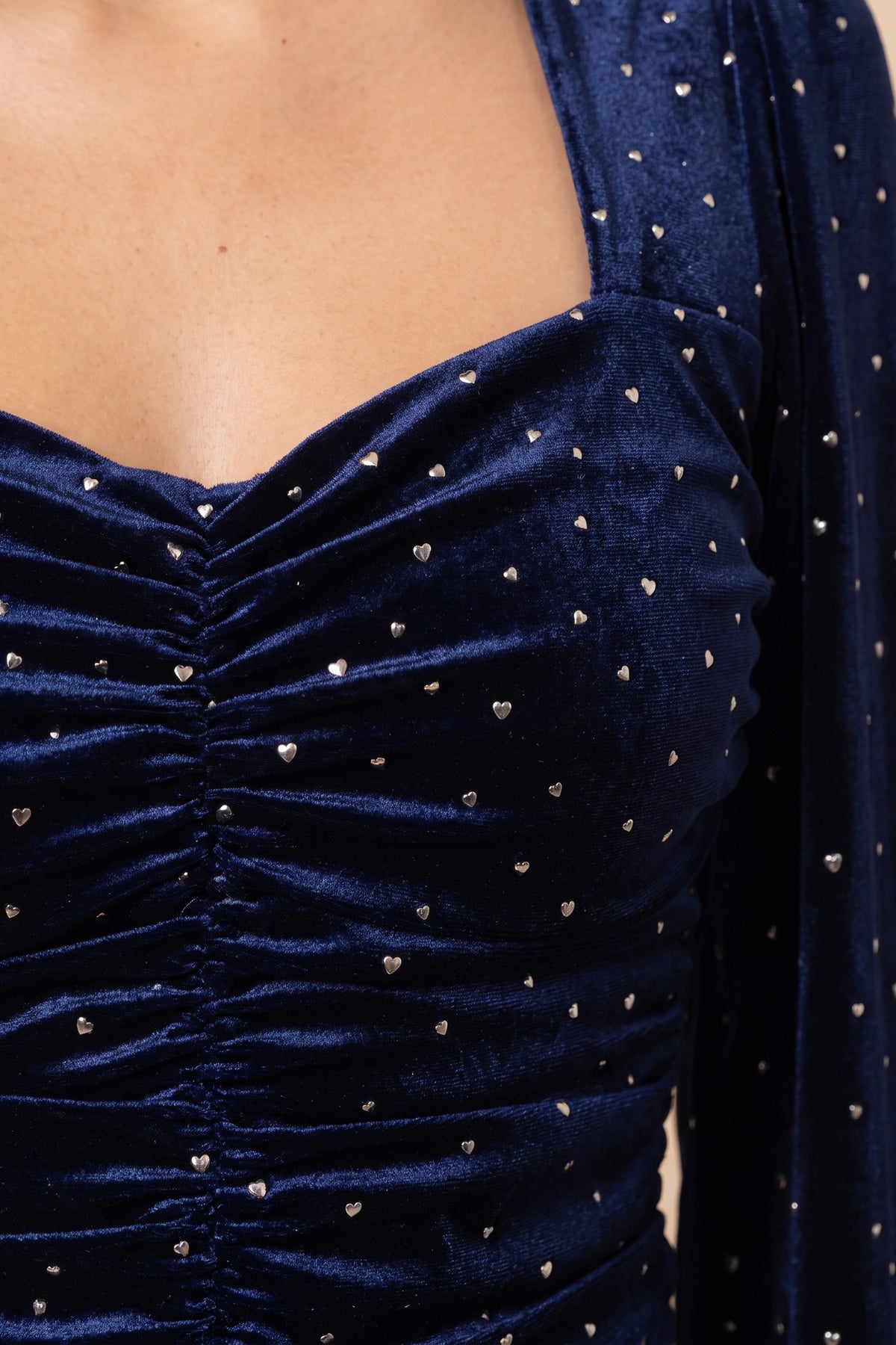 Close view of the Heart of Glass navy velvet sweetheart top showing the material and details.