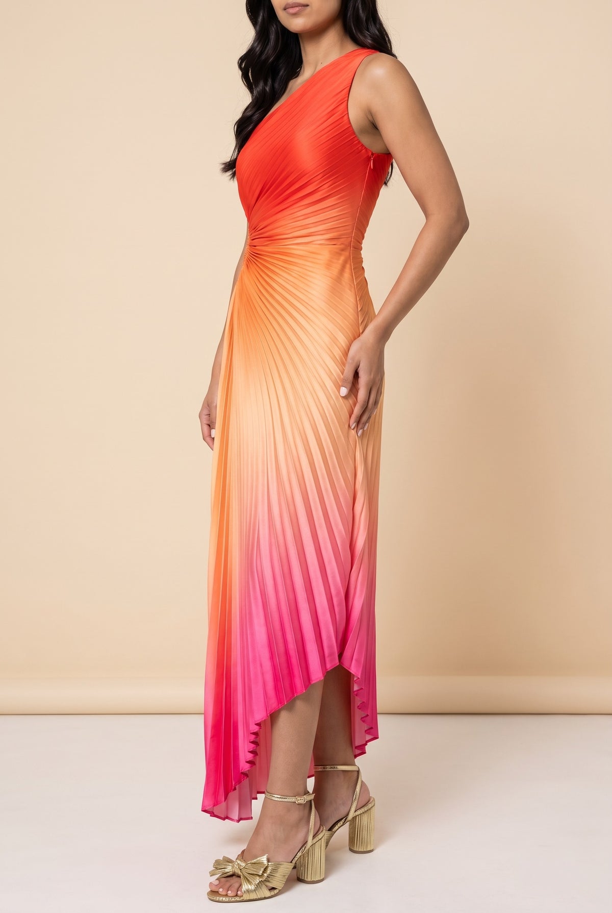 Side view of the hibiscus ombre one shoulder pleated maxi dress showing the silhouette.