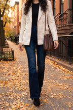 The Carrie pleated shoulder bag in chocolate pleated shoulder bag in a styled holiday look.