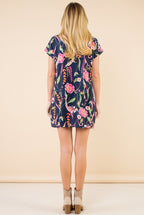 Back view of the navy floral short sleeve shift dress.
