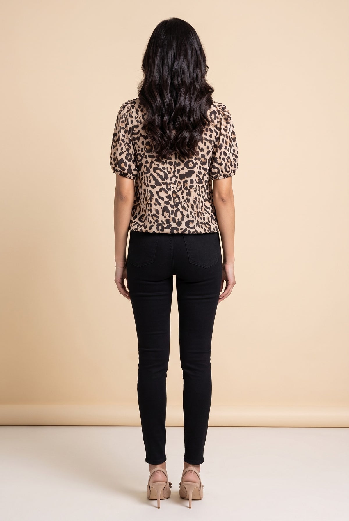 Back view of the taupe leopard puff sleeve top.