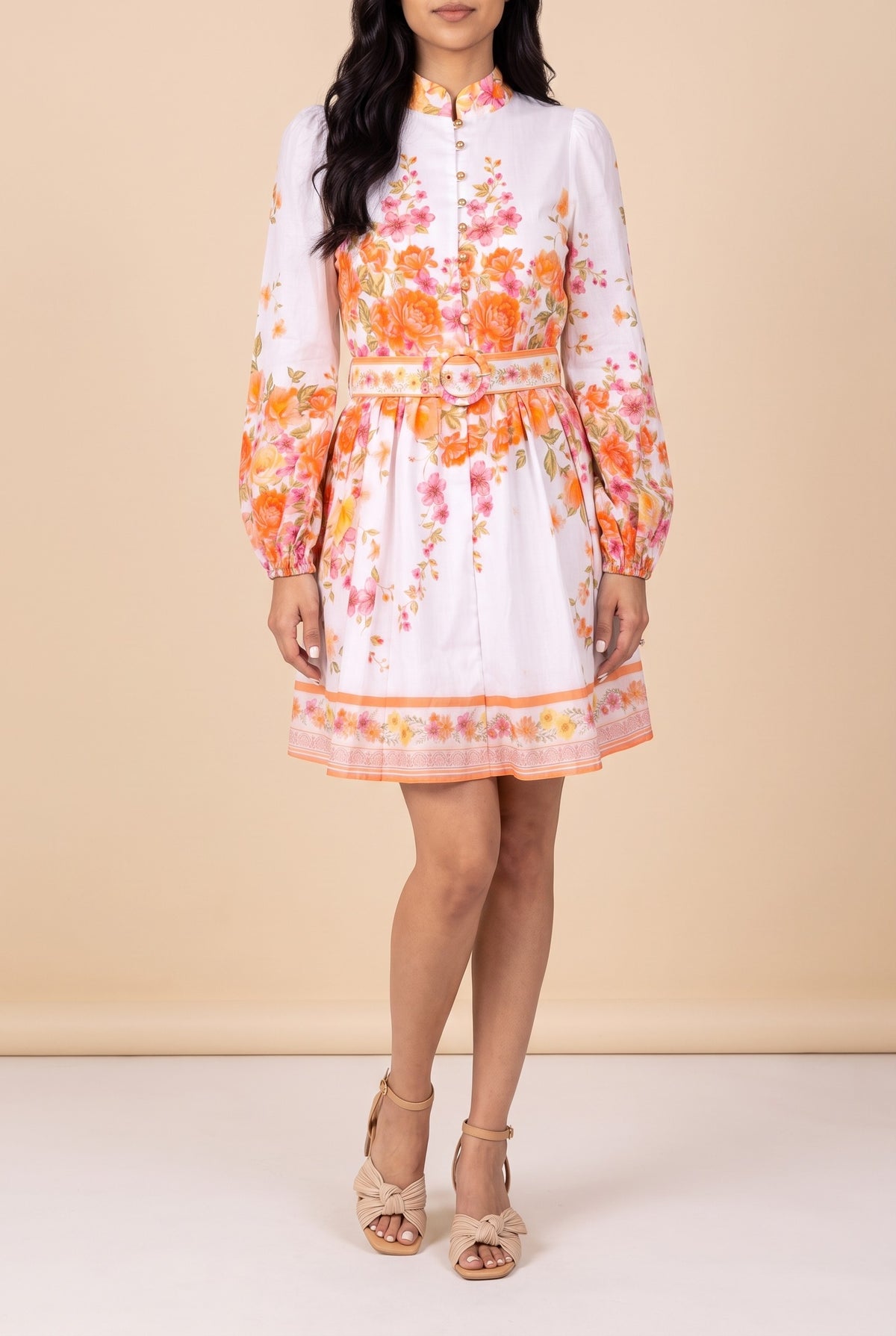 Front view of the Sweet Sunshine mock neck floral border mini dress showing the fit and length.