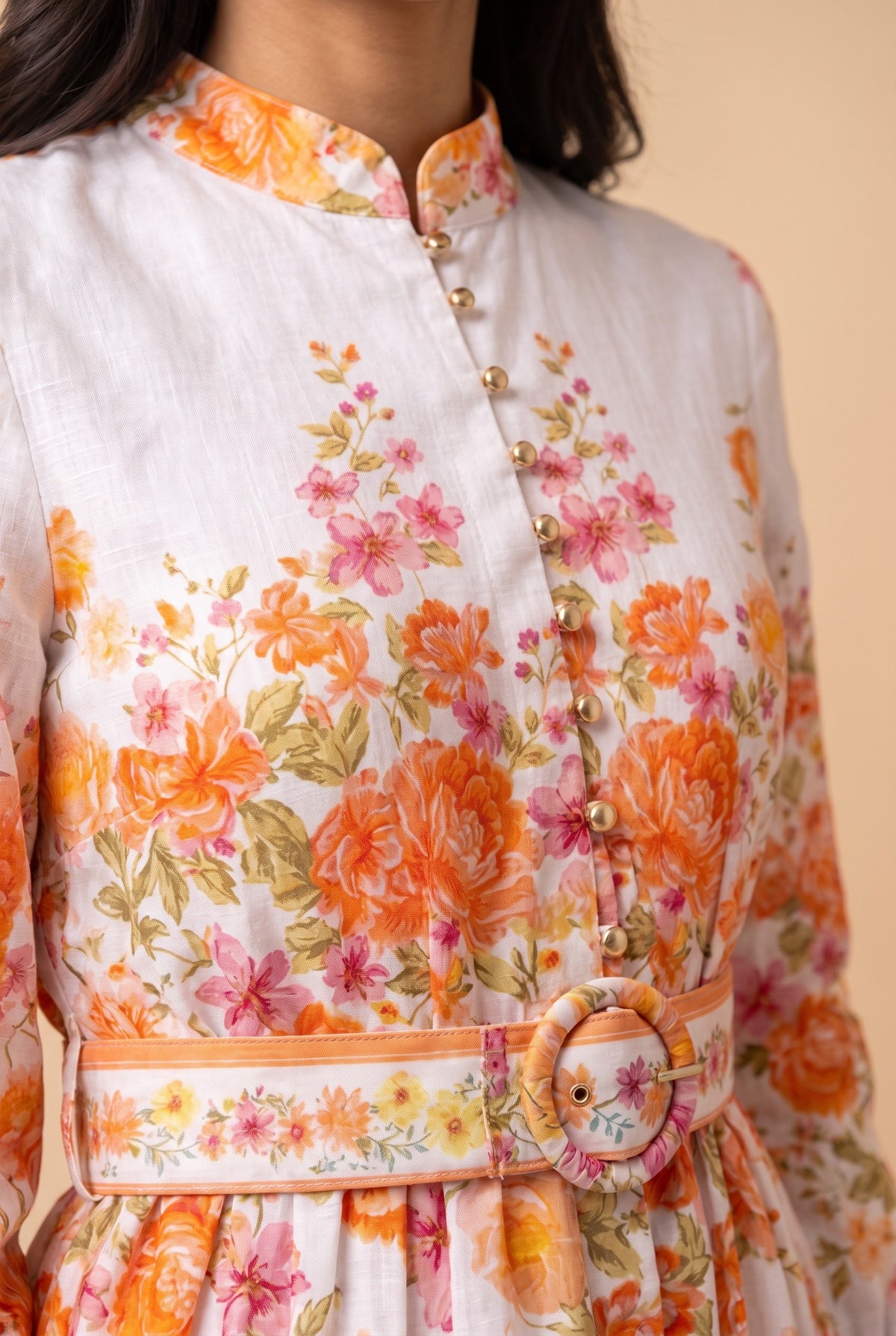 Close-up of the Sweet Sunshine mock neck floral border mini dress showing the fabric and details.