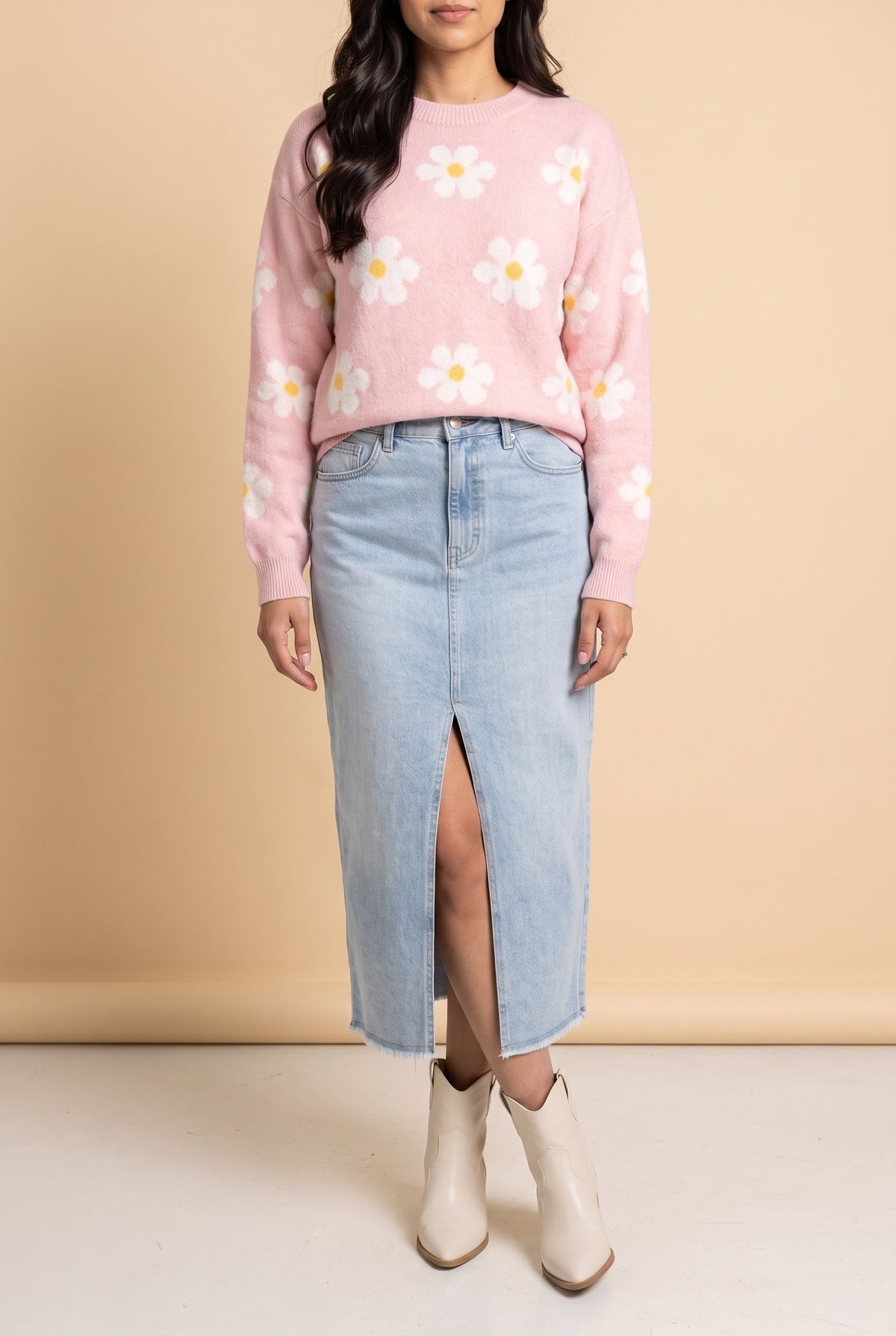 Front view of the Let's Just Stay pink daisy floral sweater showing the fit and length.