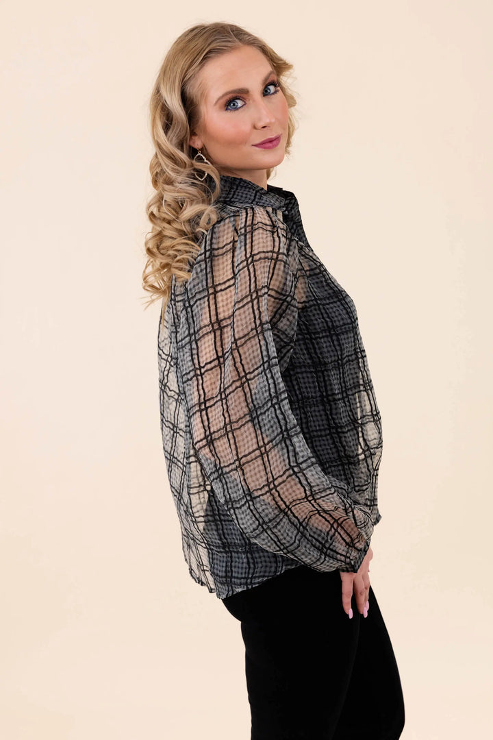 A stylish sheer plaid button-up blouse with long sleeves, featuring a lightweight and breathable design. Perfect for casual and workwear styling.