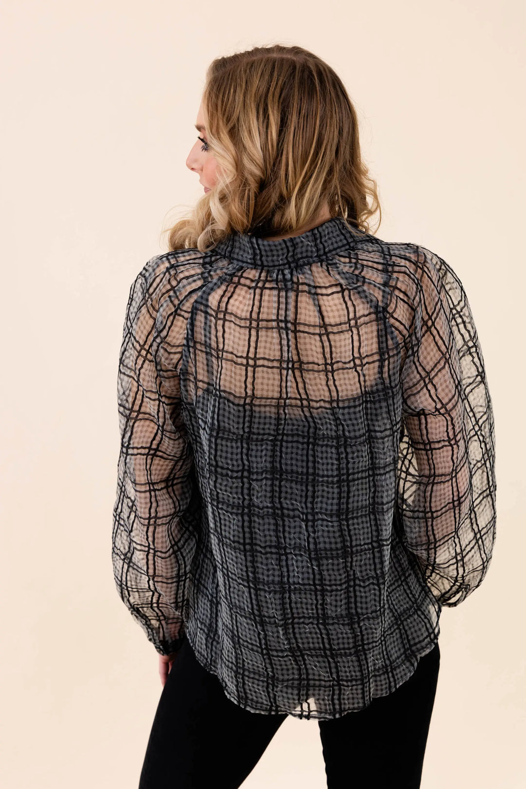 A stylish sheer plaid button-up blouse with long sleeves, featuring a lightweight and breathable design. Perfect for casual and workwear styling.