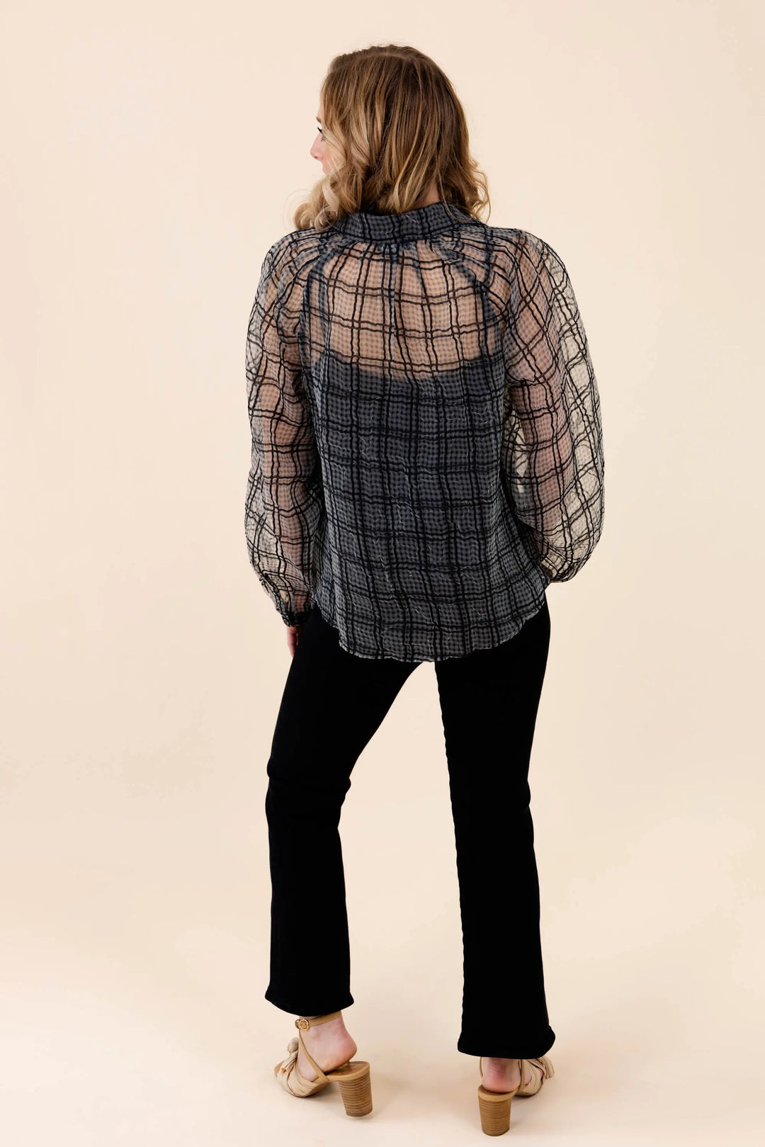 A stylish sheer plaid button-up blouse with long sleeves, featuring a lightweight and breathable design. Perfect for casual and workwear styling.