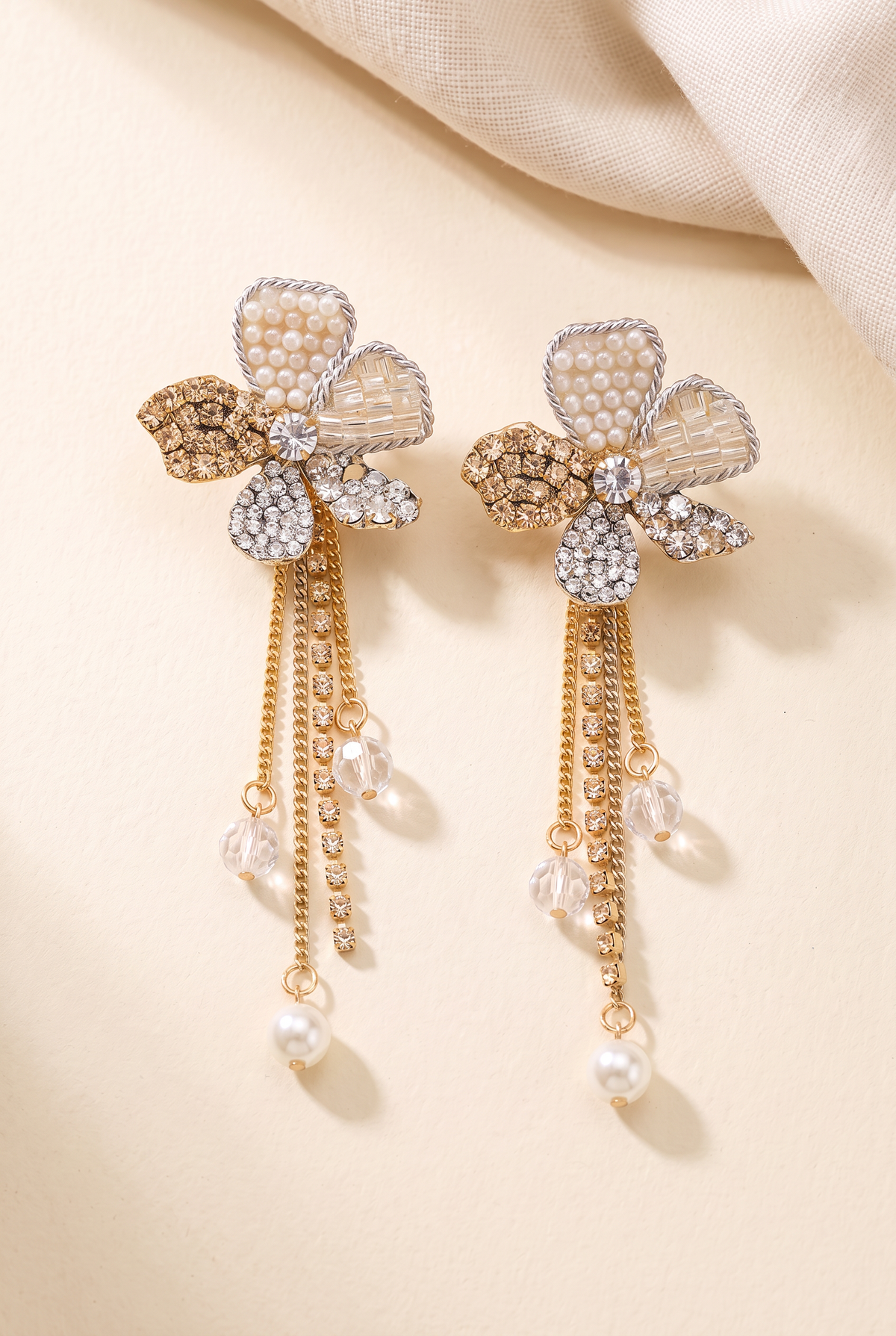 Orchid Flower Earrings pair: five-petal flower with faux pearl, bugle bead and rhinestone petals and gold chain tassels ending in a faux pearl