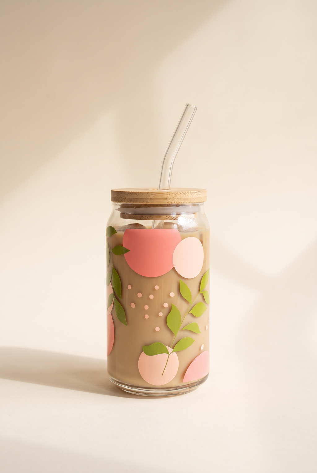 Adeline Spring Leaves Glass Cup, 16 oz clear can glass with coral and blush peaches, green leaves, bamboo lid and bent glass straw
