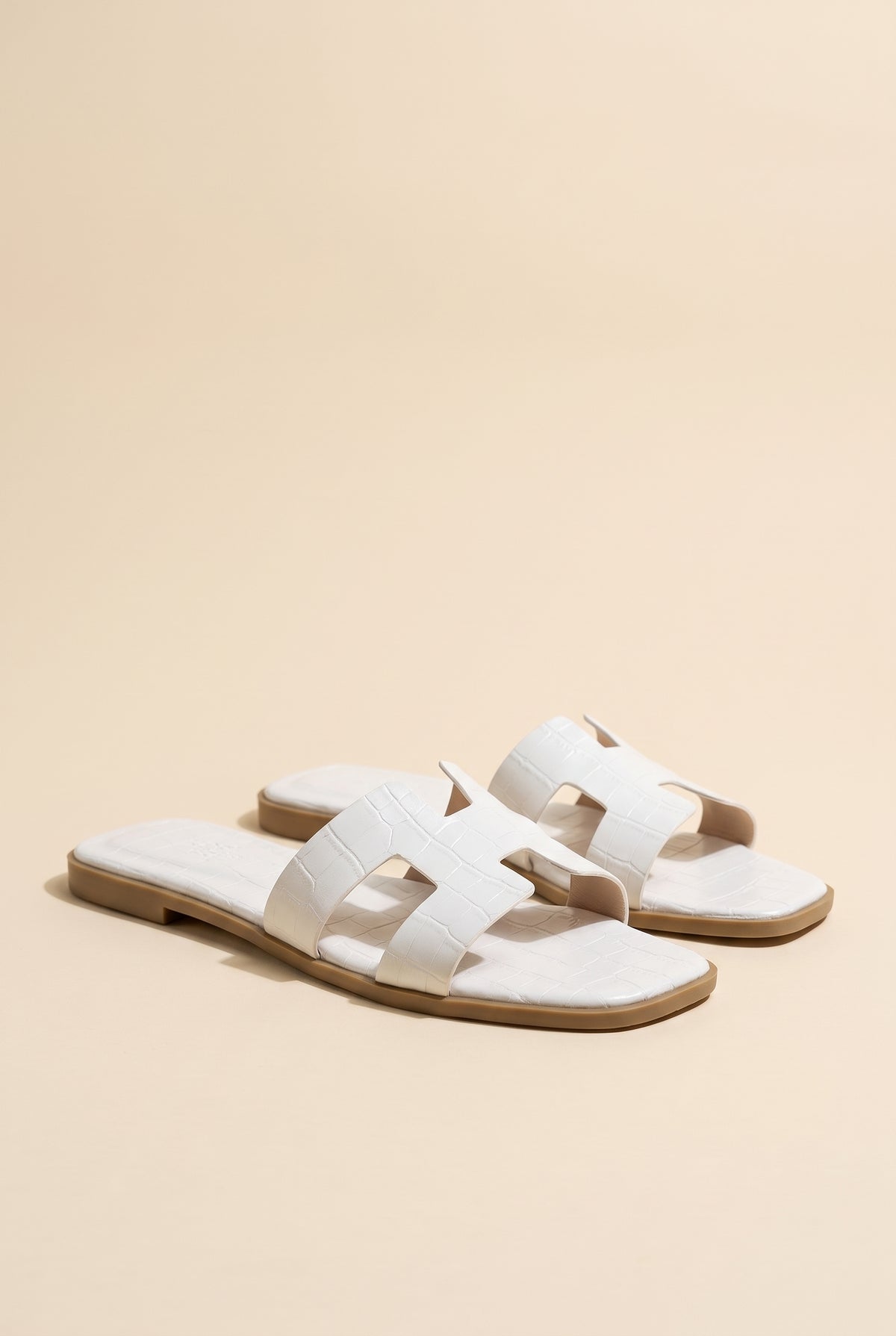 Amara H-Shaped Cutout Croc Slide Sandal, Still life