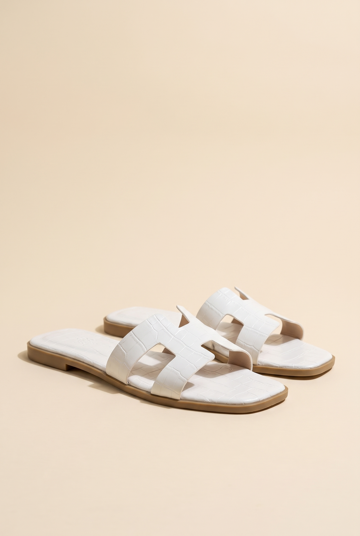 Amara H-Shaped Cutout Croc Slide Sandal, Still life