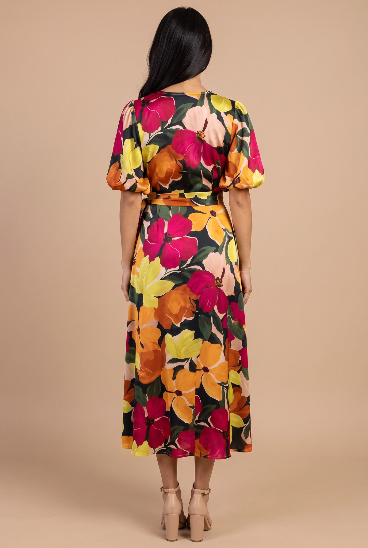 Back view of the If You're Not the One floral wrap midi dress, showing the plain back, bubble sleeves and skirt length.