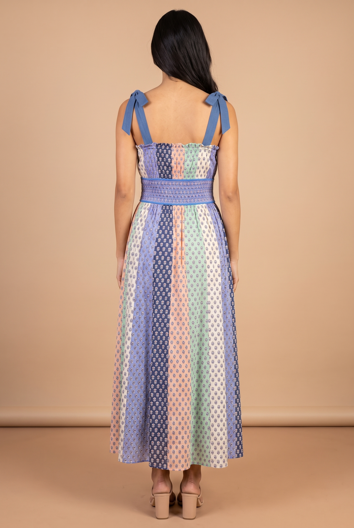 Back view of the Feeling The Sunshine maxi dress, showing the tie bows on the shoulders and the shirred waist panel.