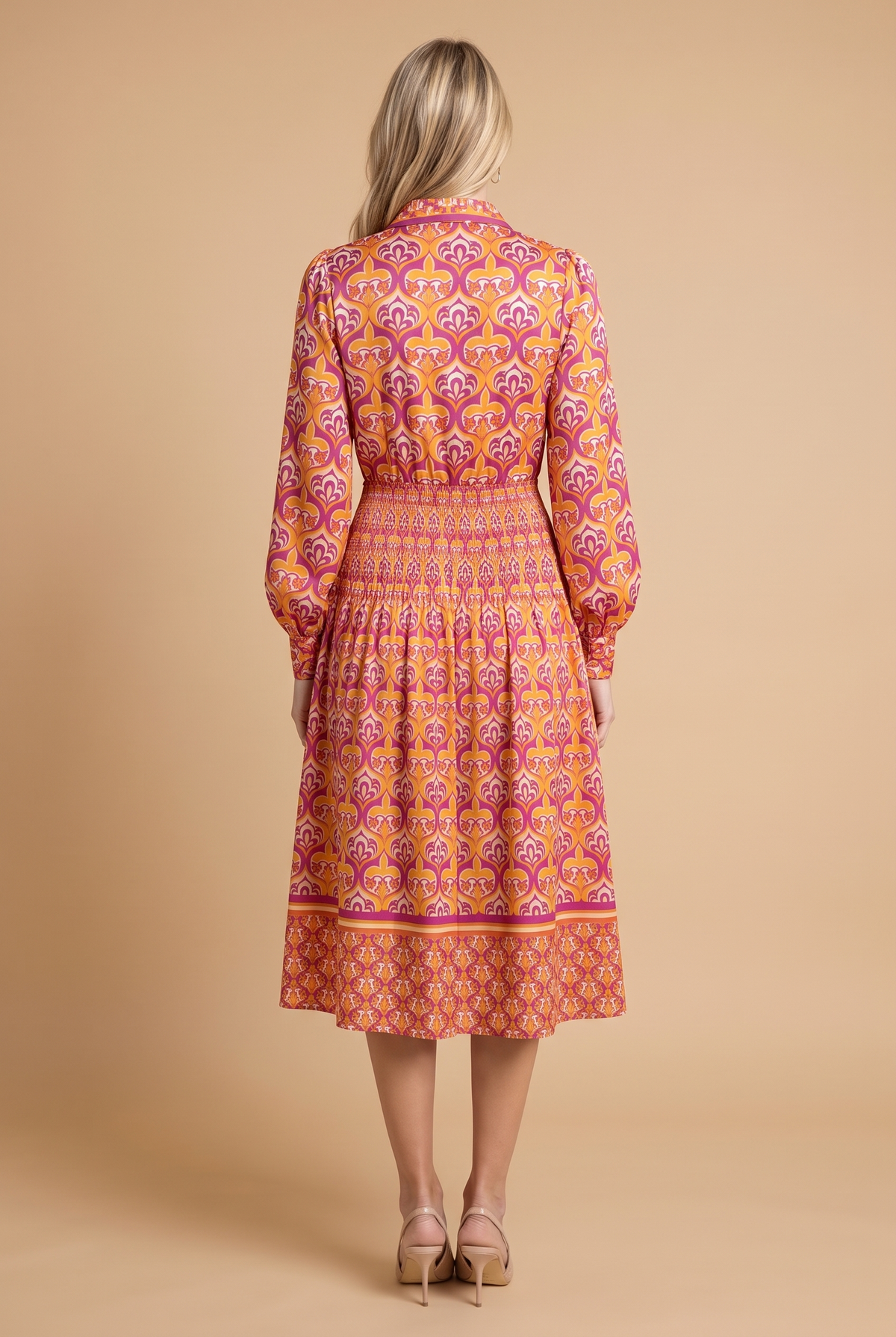 Back view of the I'm Spicing Things Up printed midi shirt dress, showing the smocked waist and the border print at the hem.
