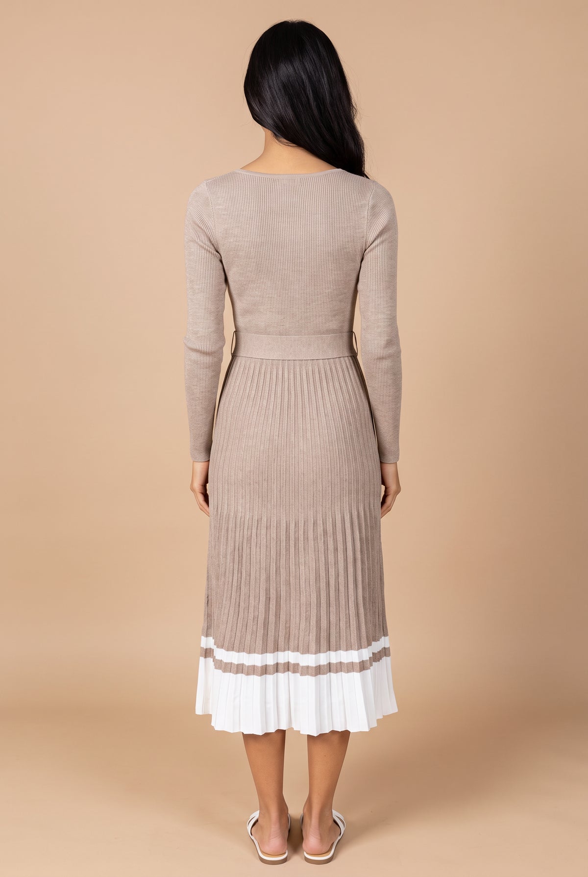 Back view of the I've Loved You For So Long pleated sweater dress, showing the plain back, belt and mid-calf pleated skirt.