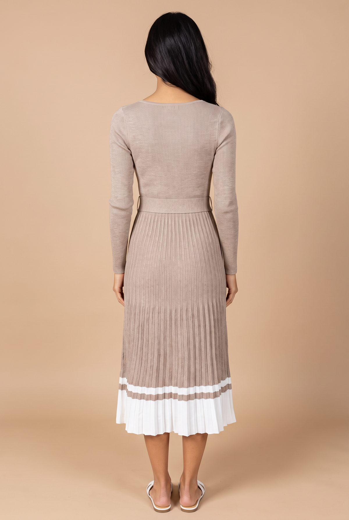 Back view of the I've Loved You For So Long pleated sweater dress, showing the plain back, belt and mid-calf pleated skirt.