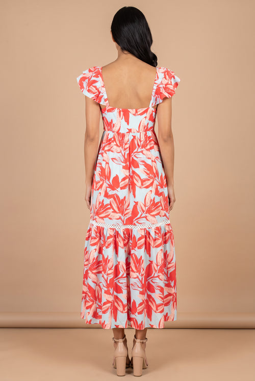 Back view of the Painted The Sky floral maxi dress, showing the square open back and flutter sleeves.