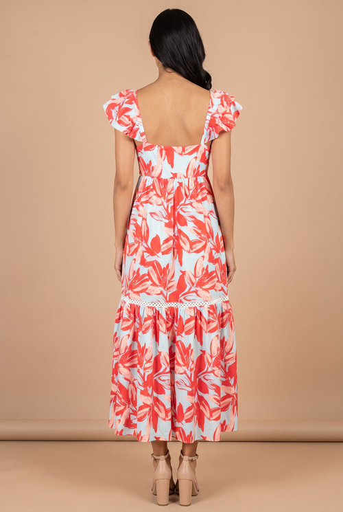 Back view of the Painted The Sky floral maxi dress, showing the square open back and flutter sleeves.