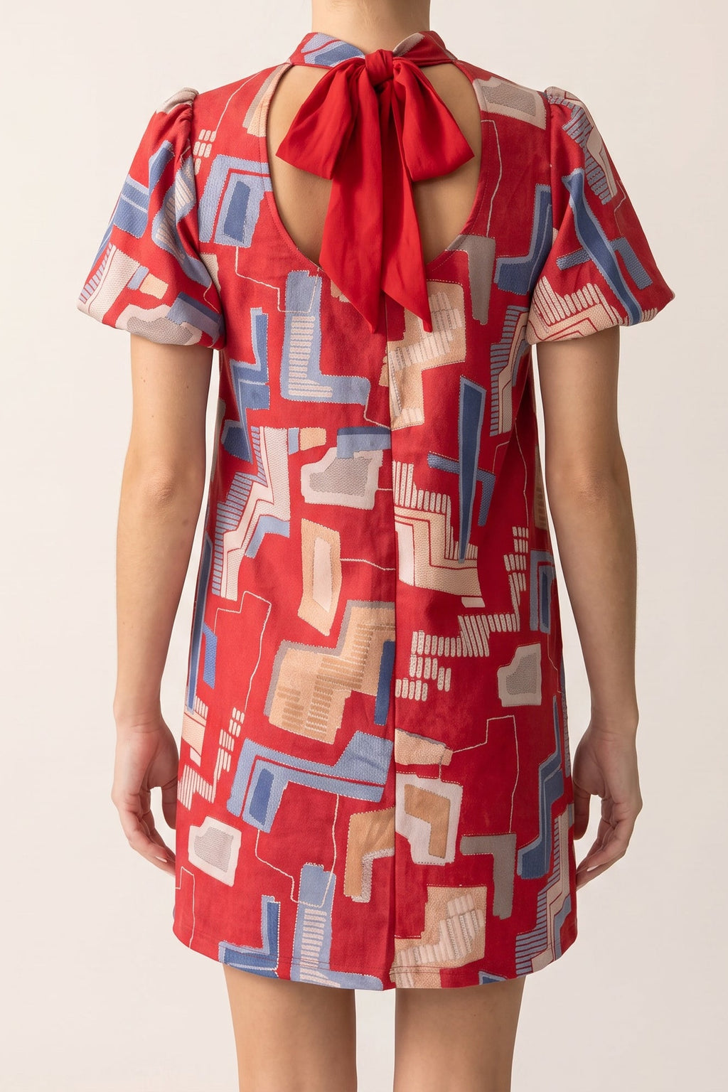 Bold Statement Bubble Sleeve Tie Back Dress, back view showing the keyhole and red tie bow