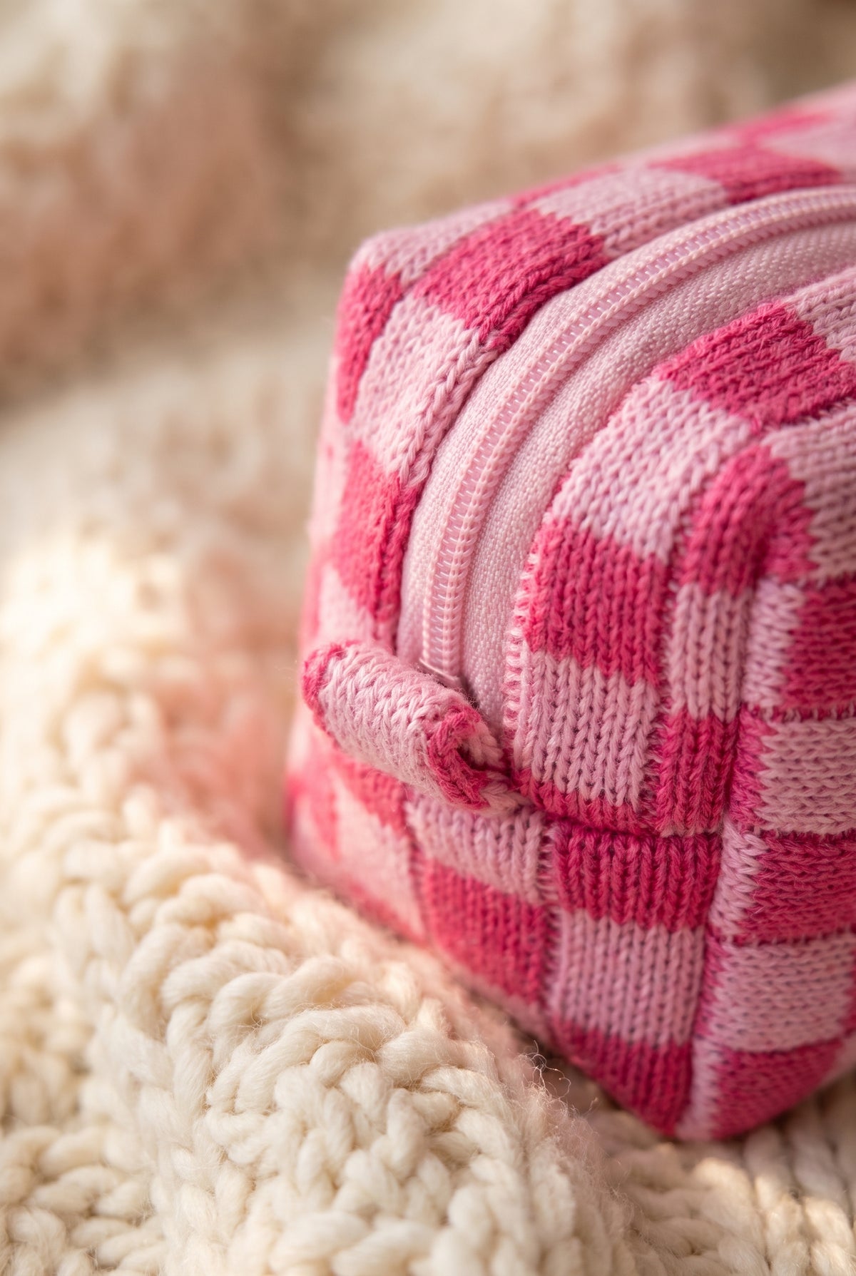 Check Yourself Cosmetic Bag in Pink, close up of the knit checks, pink zip and stitched end tab