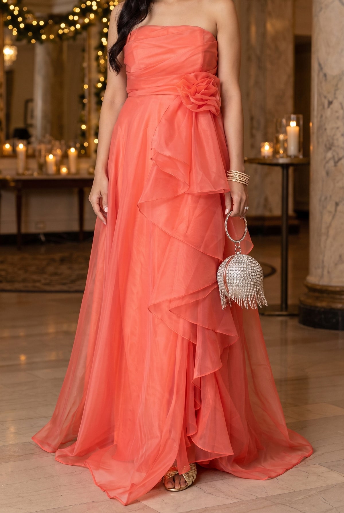Coral organza maxi dress at a holiday evening event with the Avery gold bow sandals, the Londyn rhinestone fringe bag and Nora gold bangles