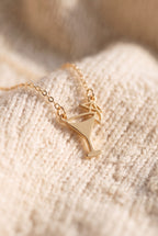 Emily Margarita Time Necklace close-up: gold cocktail glass charm with an open bowl, straight stem and a tiny umbrella, on a fine cable chain