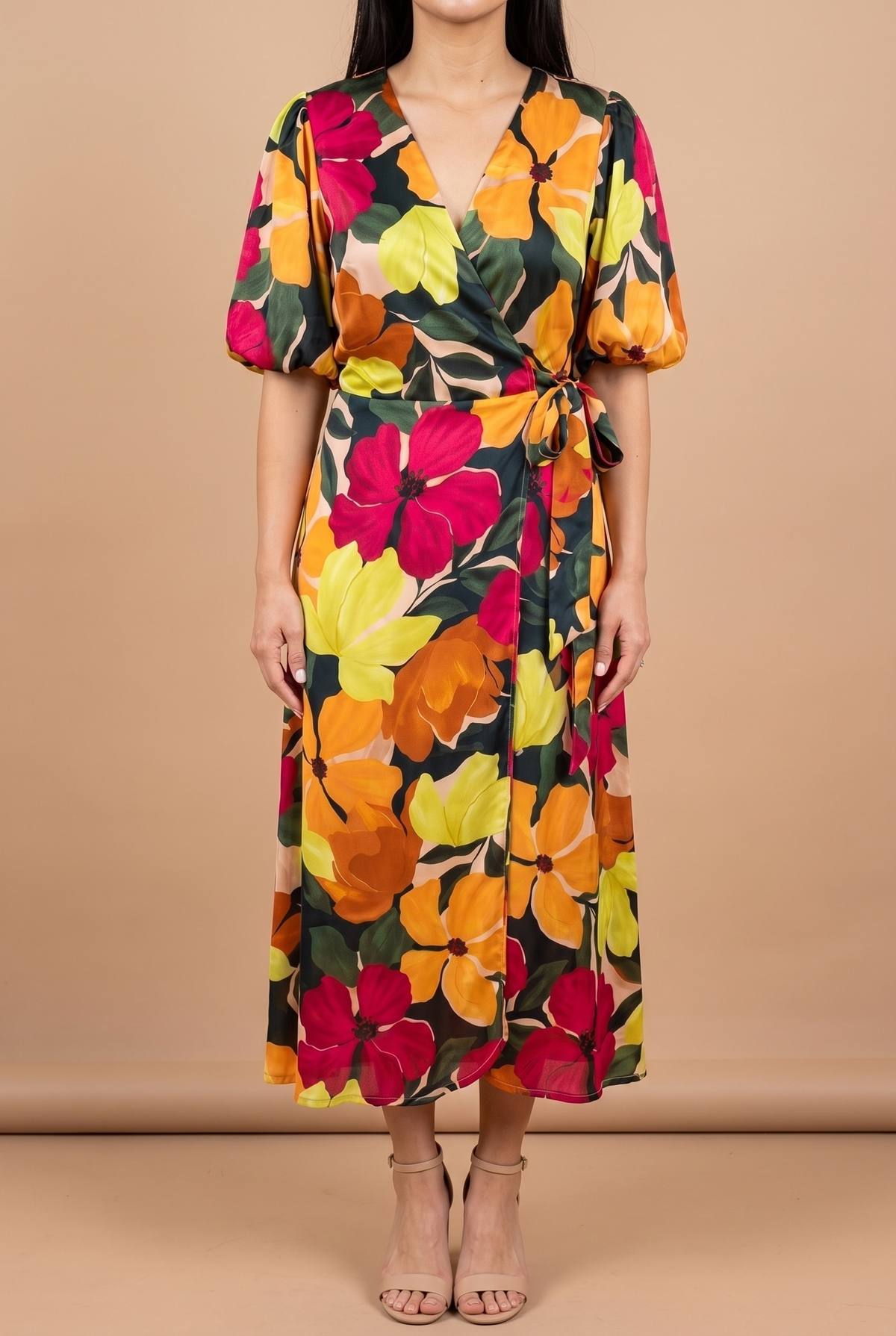 Front view of the If You're Not the One floral wrap midi dress on a beige studio backdrop, showing the V-neck wrap bodice, bubble sleeves, side tie and mid-calf hem.