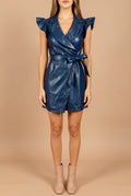 Front view of the Whenever Wherever navy faux leather wrap dress on a beige studio backdrop: flat lapel V-neck, ruffled flutter sleeves, tie belt and mini hem.