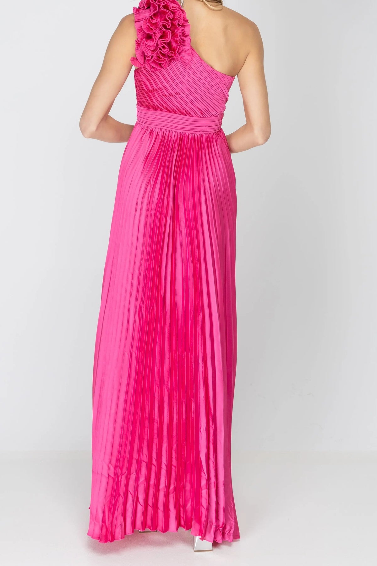 Back of the One More Night maxi dress in Fuchsia, showing the one-shoulder back and shoulder rosette