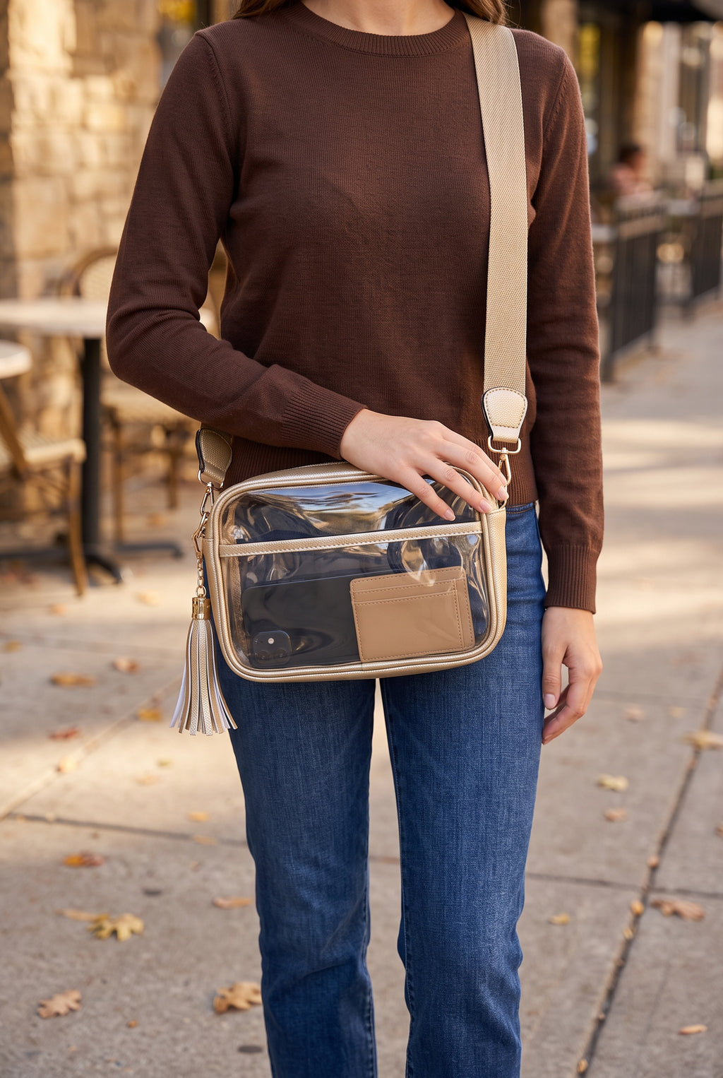 Joanna Cross Body Camera Bag in Gold worn crossbody: metallic champagne gold trim, gold and white tassel, khaki strap