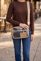 Joanna Cross Body Camera Bag in Gold worn crossbody: metallic champagne gold trim, gold and white tassel, khaki strap