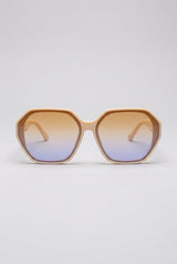 Haven oversized sunglasses in cream Coconut Cream frame with amber-to-blue gradient lenses, front view on a light-grey backdrop