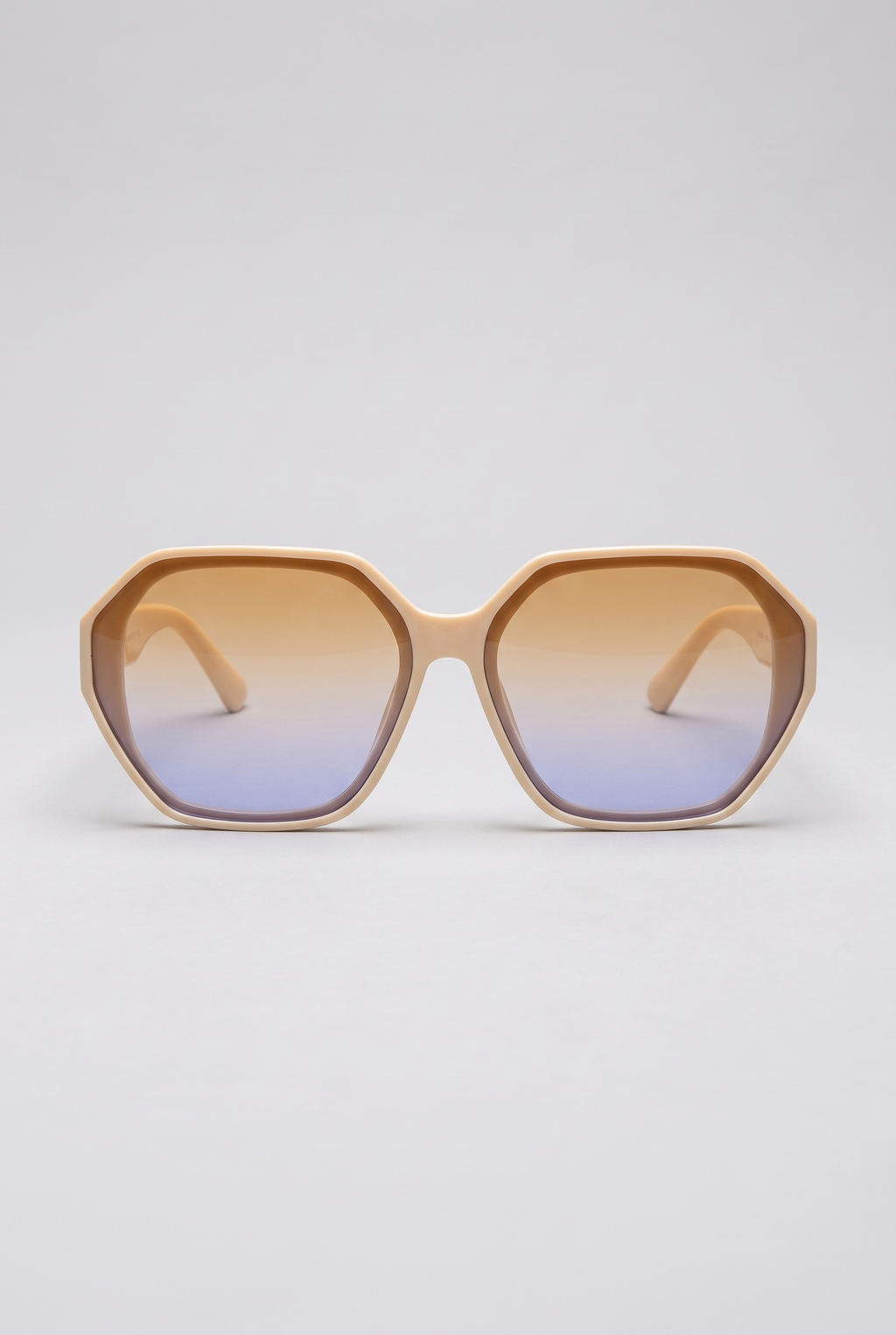 Haven oversized sunglasses in cream Coconut Cream frame with amber-to-blue gradient lenses, front view on a light-grey backdrop