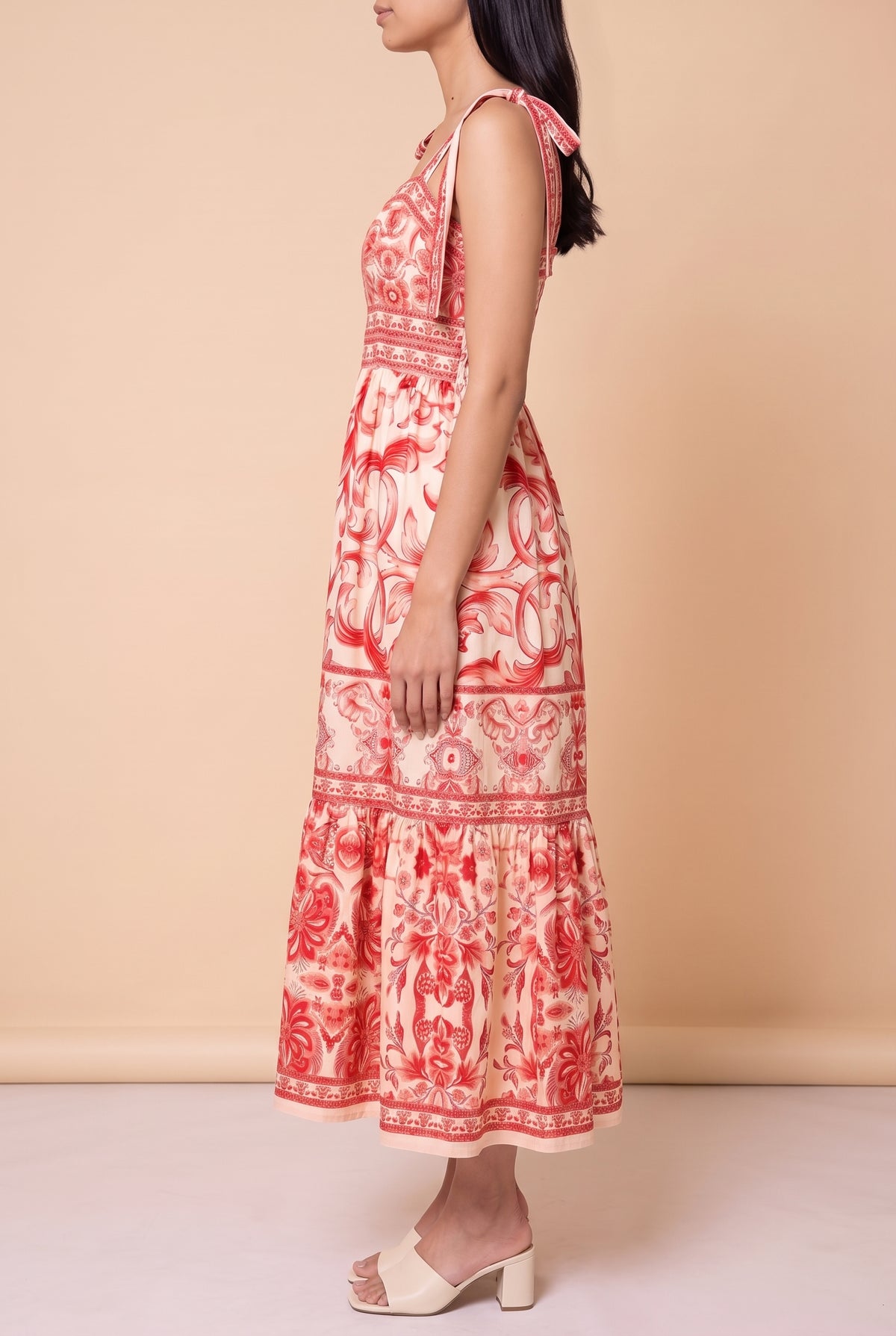 Side view of the For Another Time Maxi Dress showing the A-line tiered skirt and lower calf length.