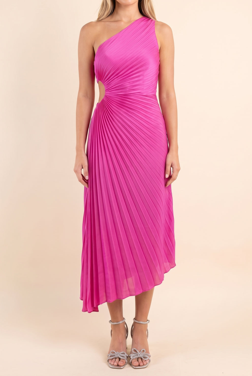 Front of the Last Friday Night fuchsia pleated one-shoulder midi dress, with the small waist cutout on the bare-shoulder side.