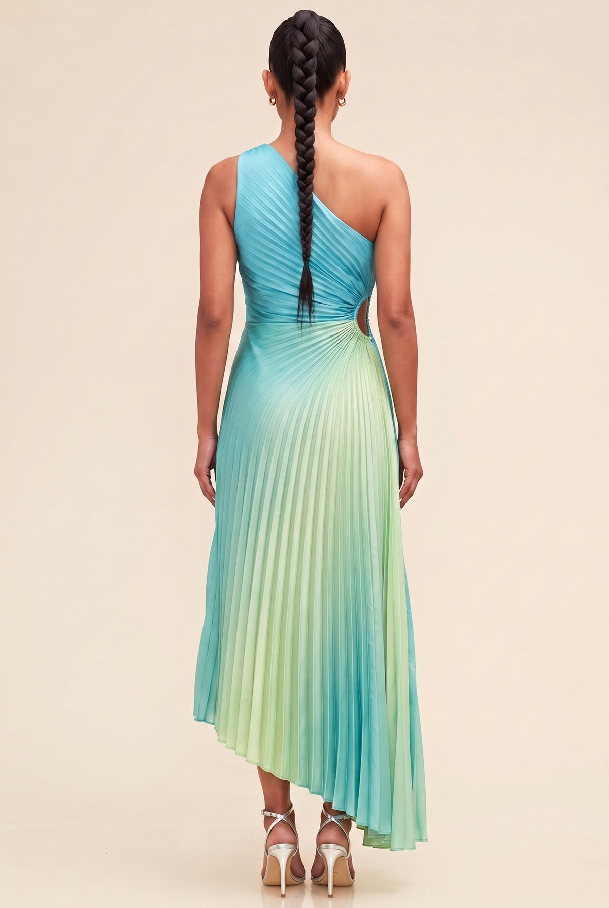 Back view of the Island In The Sun ombre pleated one-shoulder dress showing the strap, waist cutout and high-low hem