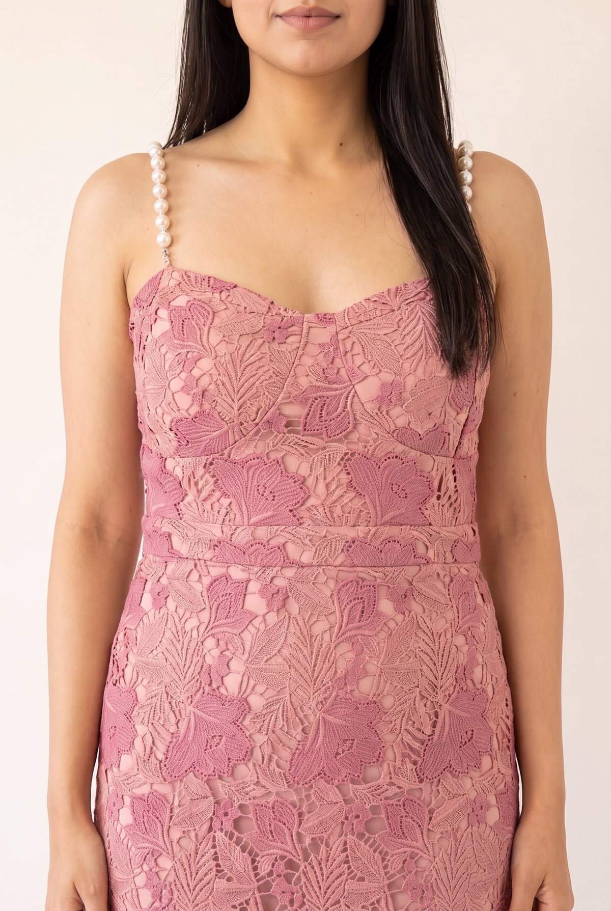Close view of the pink lace bodice with pearl straps and sweetheart neckline