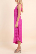 Side of the fuchsia pleated midi dress showing the strap shoulder and the asymmetric midi hem.