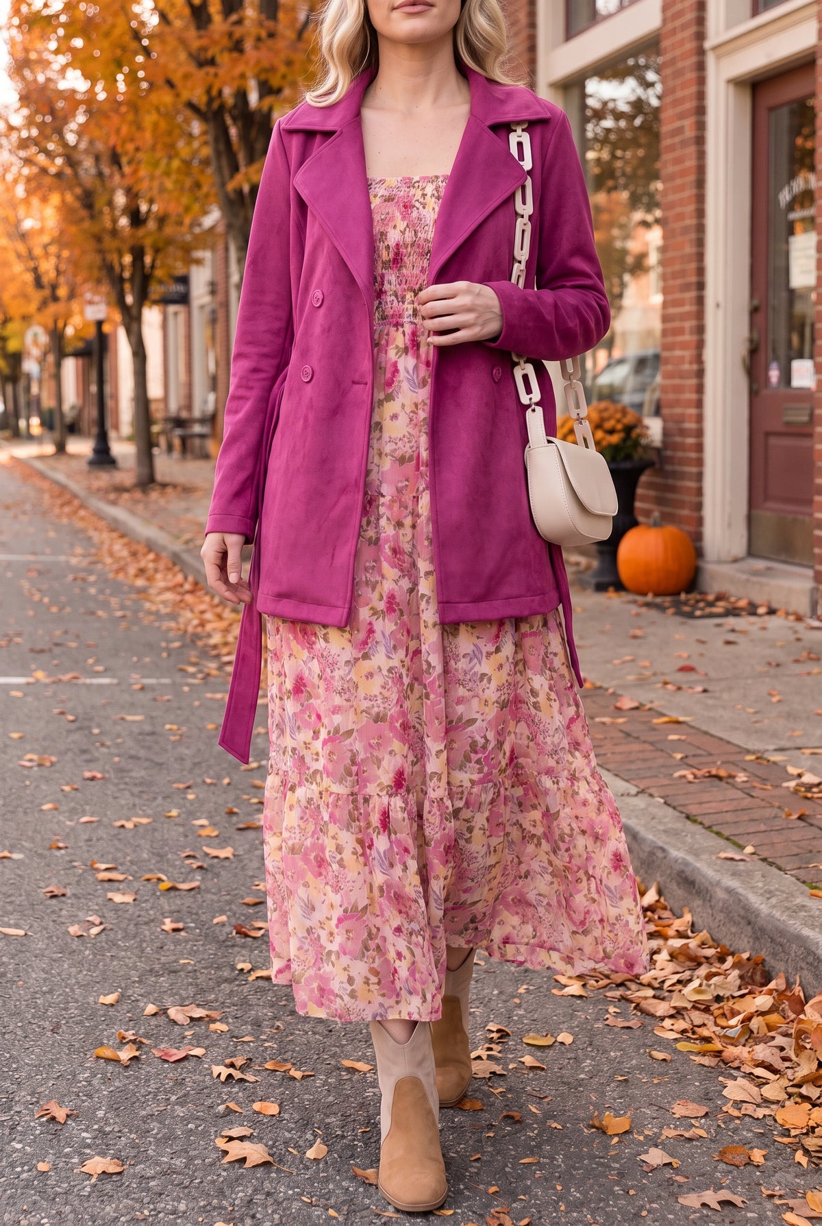 The pink floral smocked maxi dress on an autumn street with a berry suede trench, tan suede ankle booties and a cream chain shoulder bag.