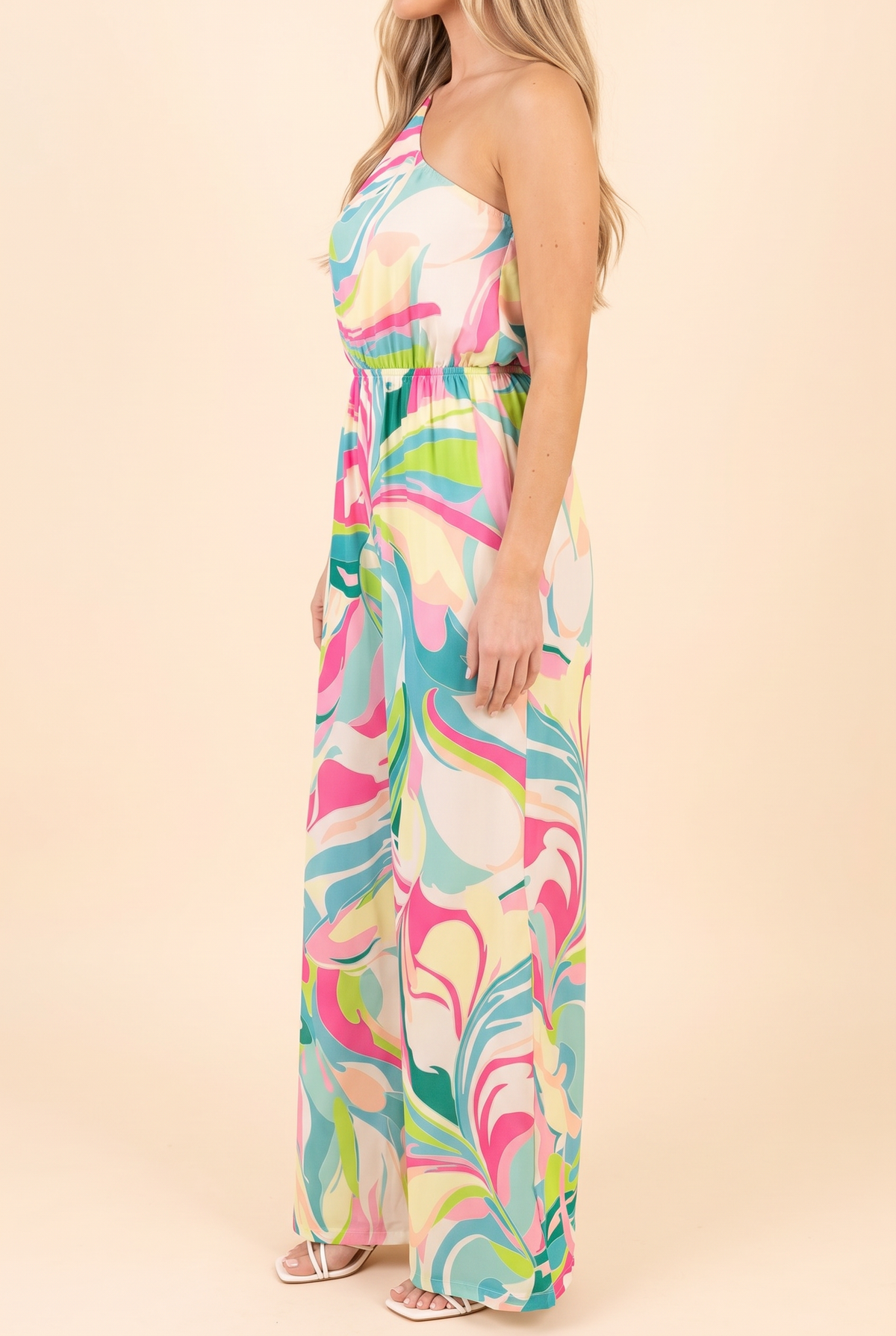 Side of the one-shoulder swirl print jumpsuit showing the blouson bodice and floor-length wide leg.