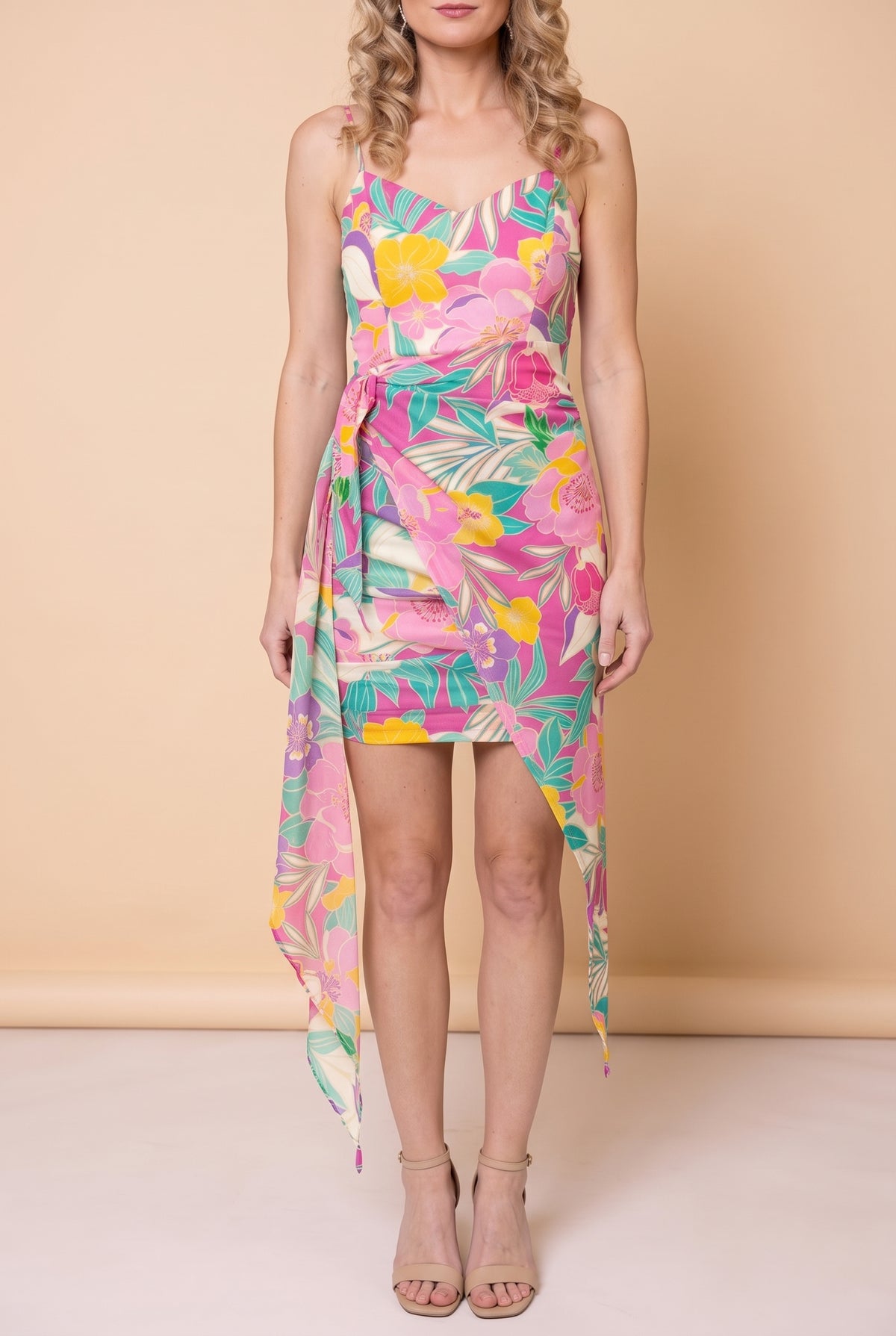 Front view of the Dressed for Sweet Moments Mini Dress: tropical floral print, spaghetti straps, ruched wrap at the hip and a long sheer sash panel.