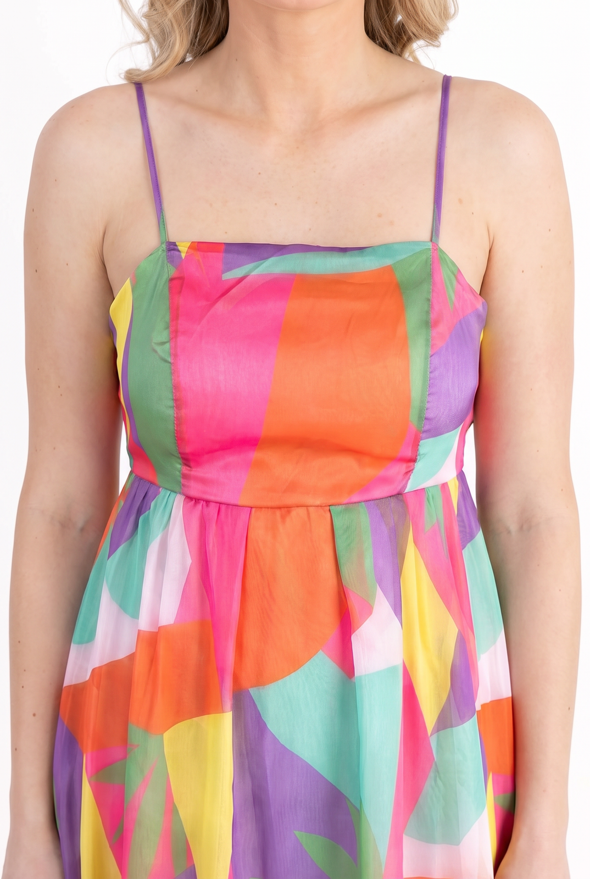 Close-up of the colour-block geometric print, straight neckline, spaghetti straps and the sheer floaty skirt.