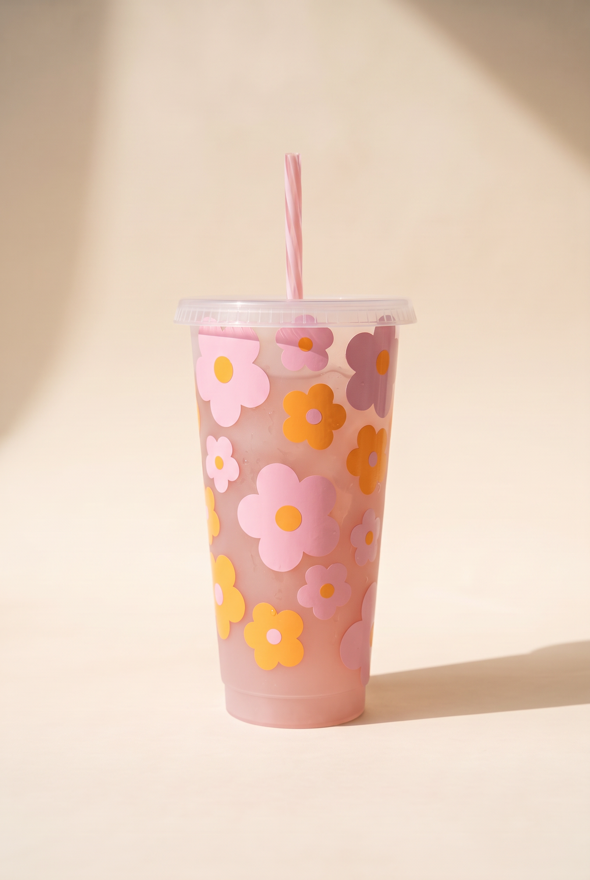 Myla retro flowers iced coffee cup, 24 oz frosted pink reusable cold cup with pink, mauve and orange flower decals, clear lid and striped straw